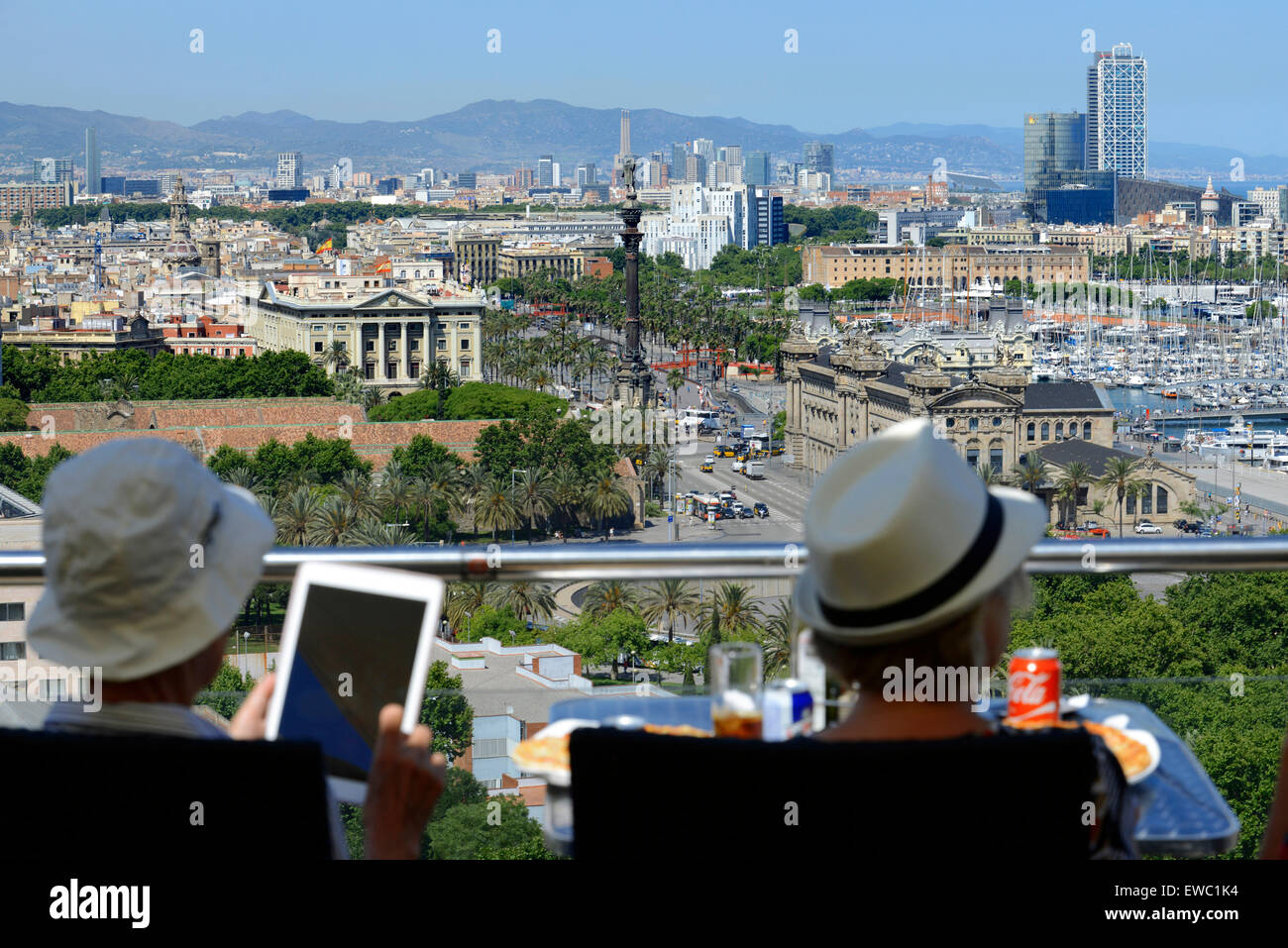 The Romantic route in Barcelona. Tourist relaxing and view the landscape in Monjuic mountain.  View of Barcelona Harbour. Above Stock Photo