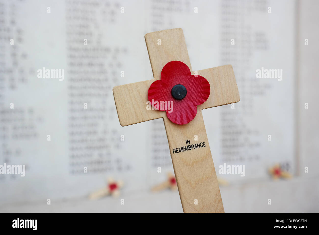 Remembrance cross with poppy and the Memorial to the Missing Stock Photo