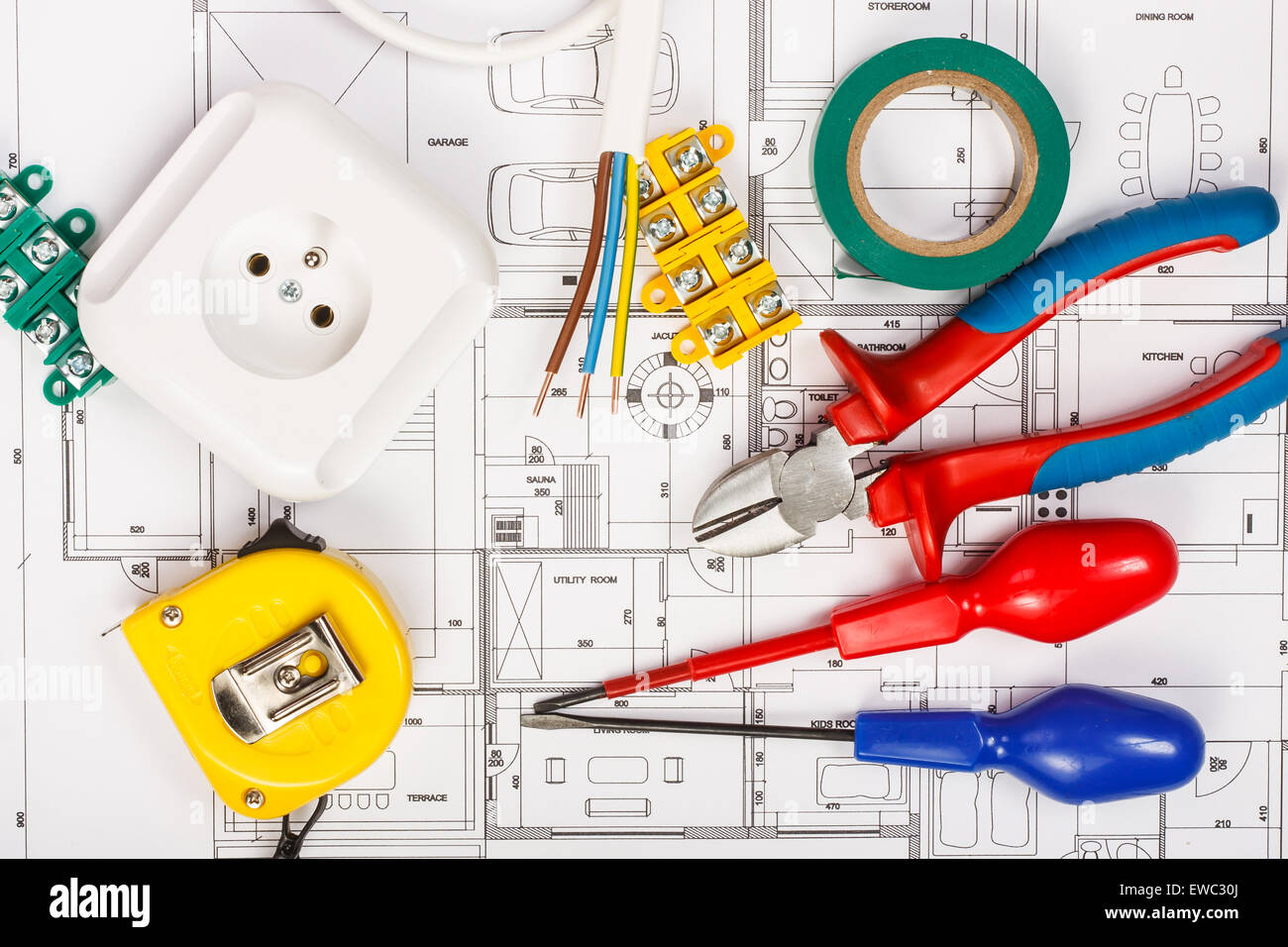 Electrical equipment and tools on house plans Stock Photo