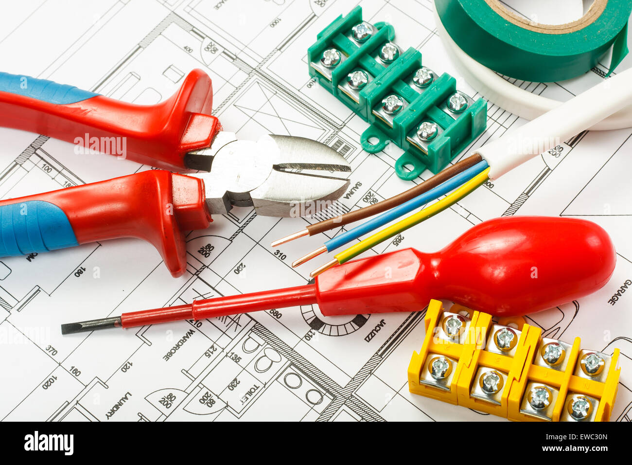 Electrical equipment and tools on house plans Stock Photo