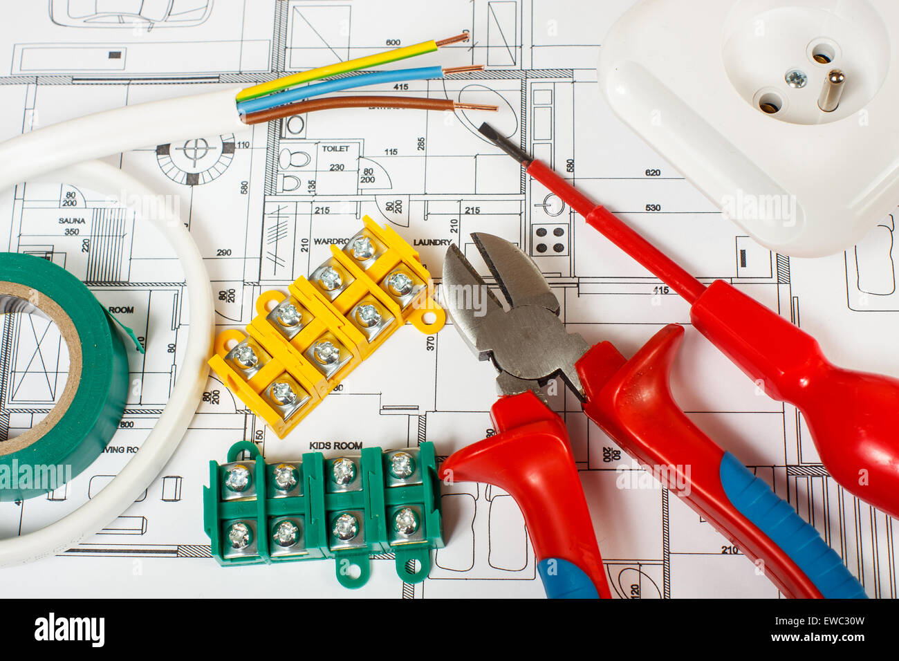 Electrical equipment and tools on house plans Stock Photo