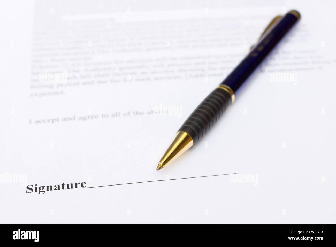 Pen for signature lying on white contract paper Stock Photo