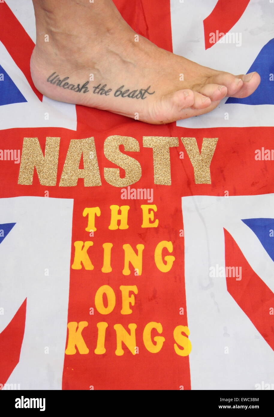 Veteran toe wrestling champion Alan 'Nasty' Nash displays a tattoo at the World Toe Wrestling Championships 2015 Derbyshire UK Stock Photo