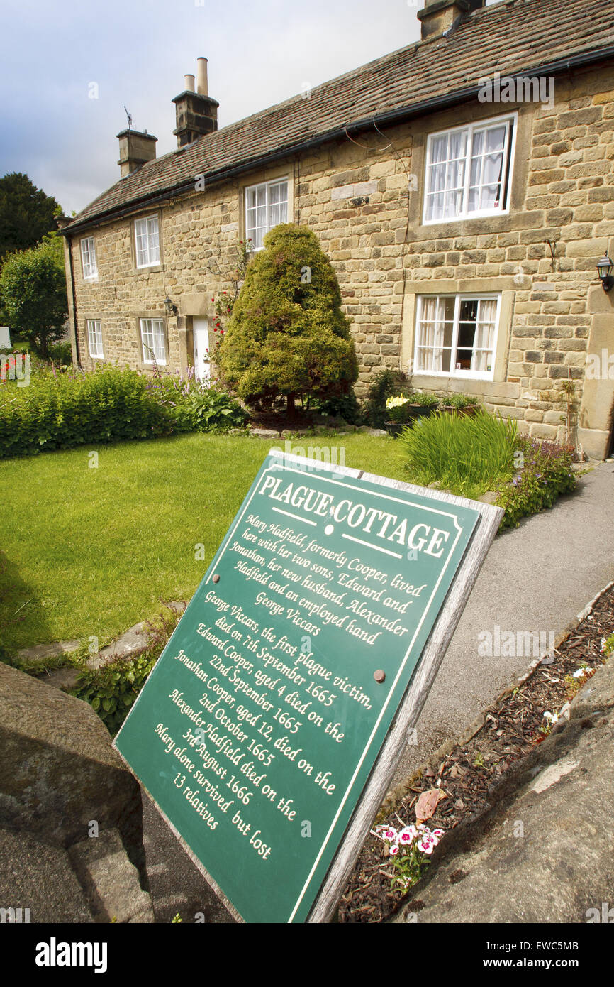 A row of 'plague cottages' where families affected by a plague died in Eyam village, Peak District, Derbyshire, UK - summer Stock Photo