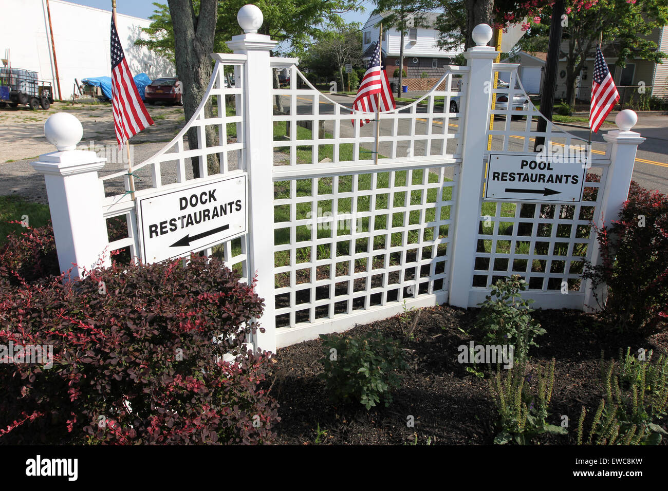 Signs direct motorists to the Babylon Village waterfront Stock Photo