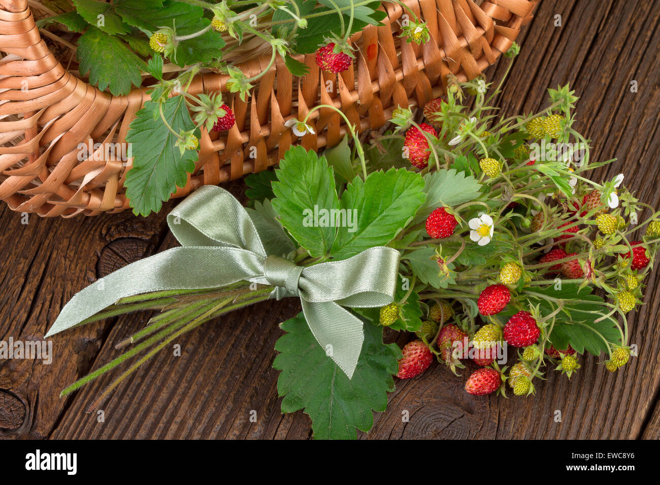 woodland strawberries on wooden background Stock Photo