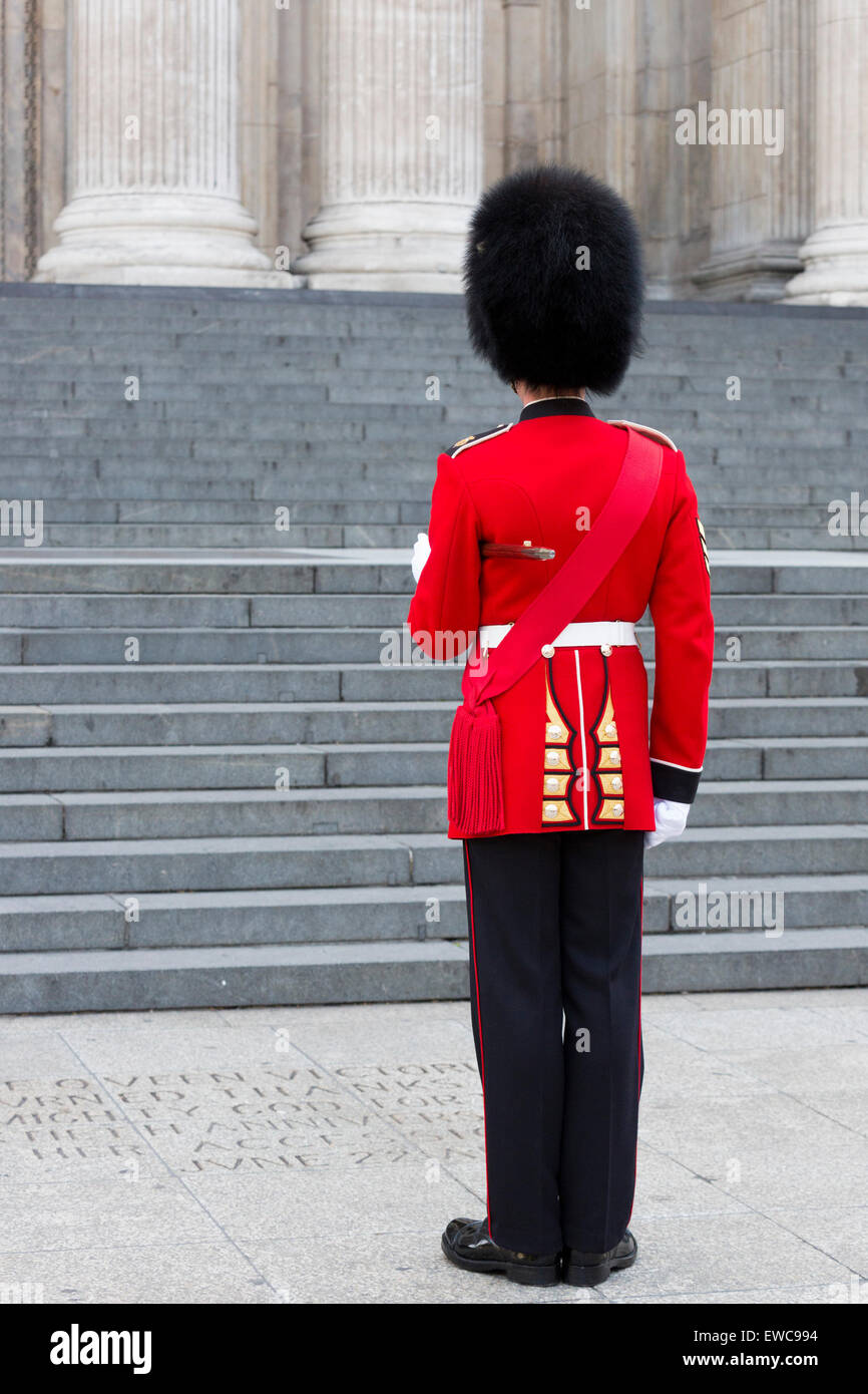 A Queen's Guard, Grenadier Guard, guardsman, stands to attention in