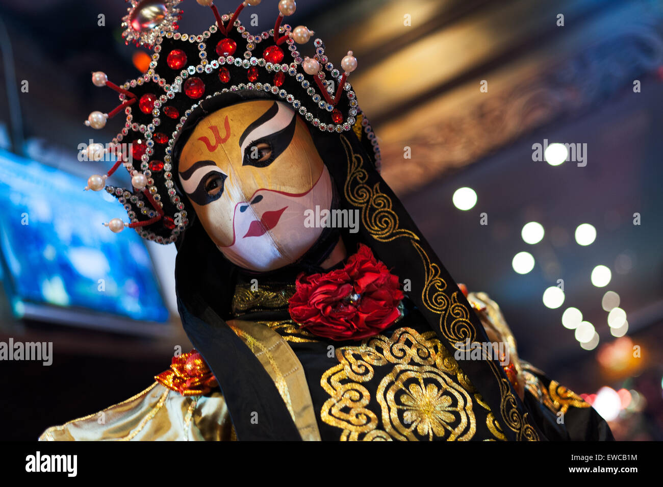 Chengdu, China - December 29 2014: Chinese artist perform traditional face-changing art at Chunxifang Chunxilu Stock Photo