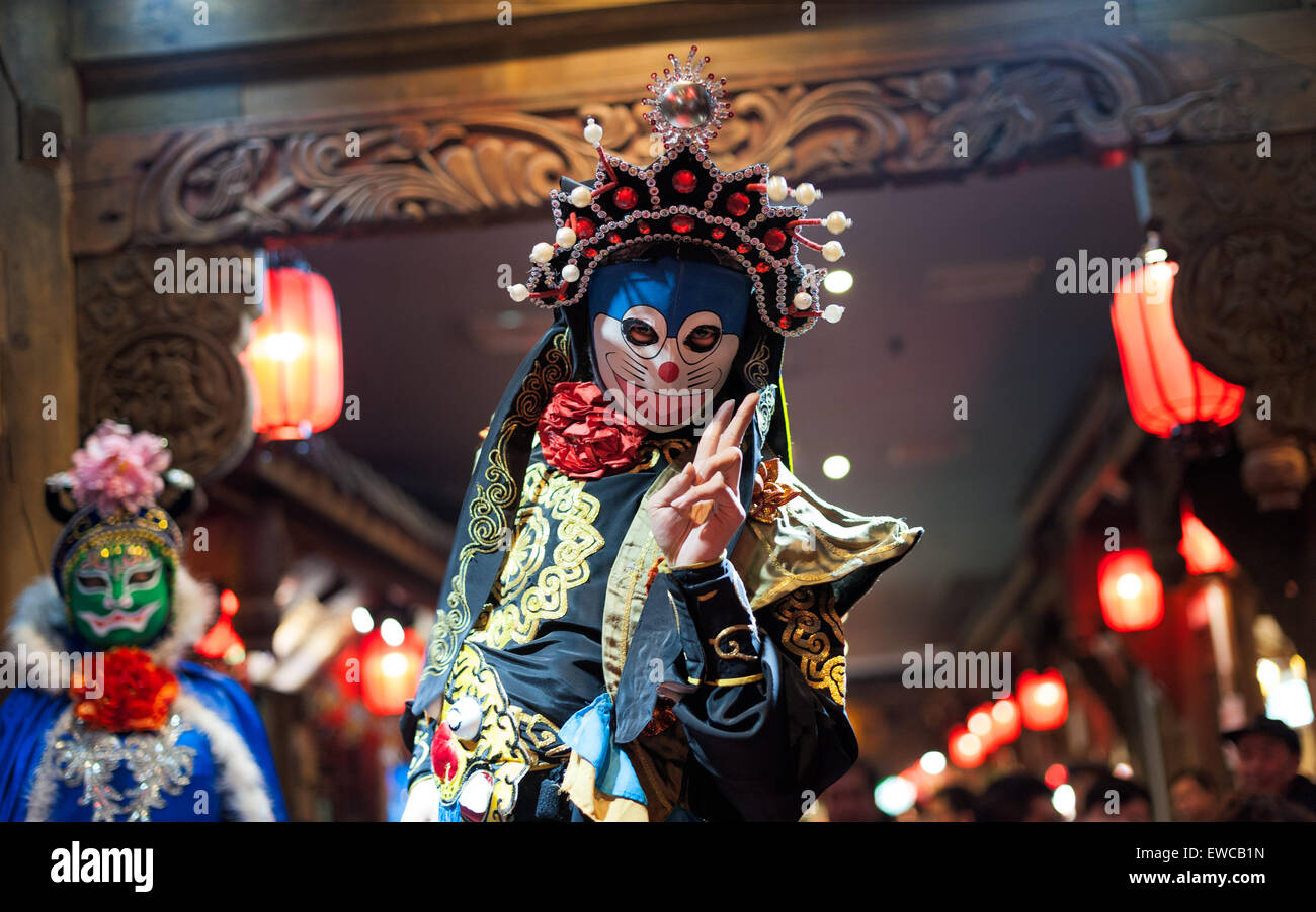 Chengdu, China - December 29 2014: Chinese artist perform traditional face-changing art at Chunxifang Chunxilu Stock Photo