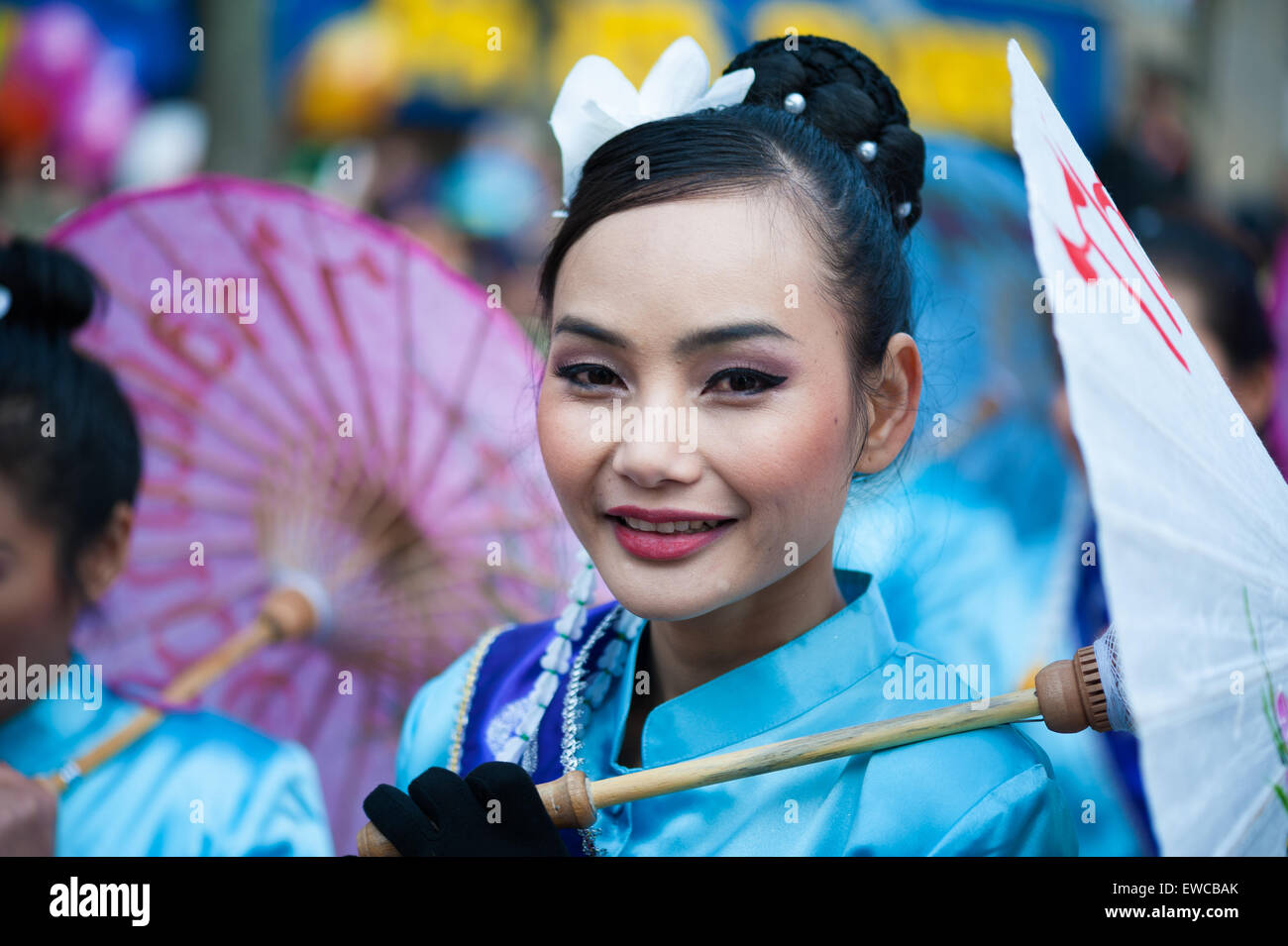 Paris - February 17, 2013: Beautiful Chinese girl parades at the Lunar New Year Festival. Stock Photo