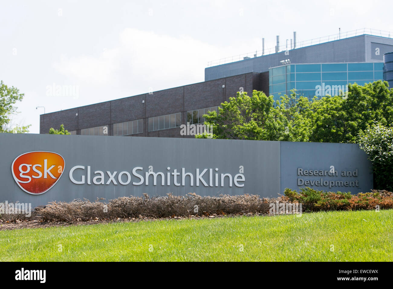 A logo sign outside of a facility occupied by GlaxoSmithKline in King