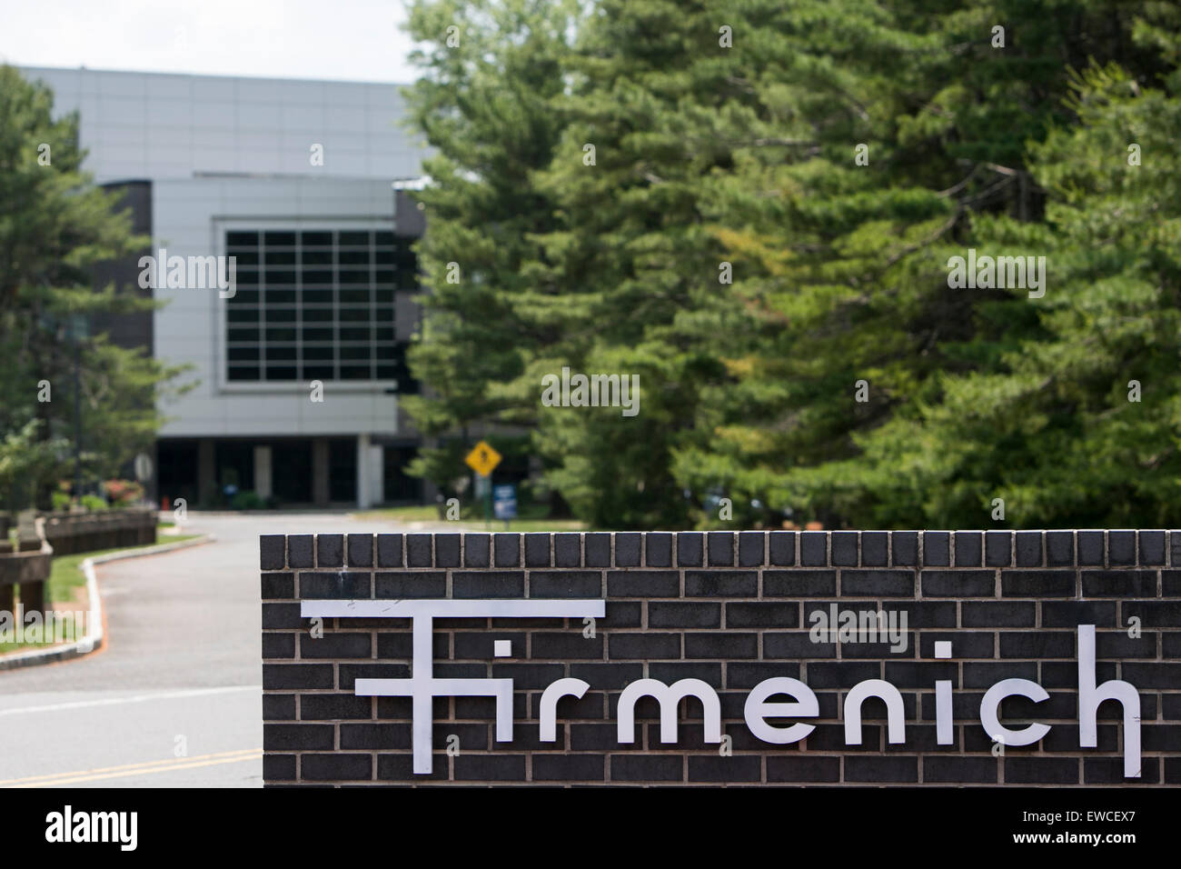 A logo sign outside of a facility occupied by Firmenich in Plainsboro