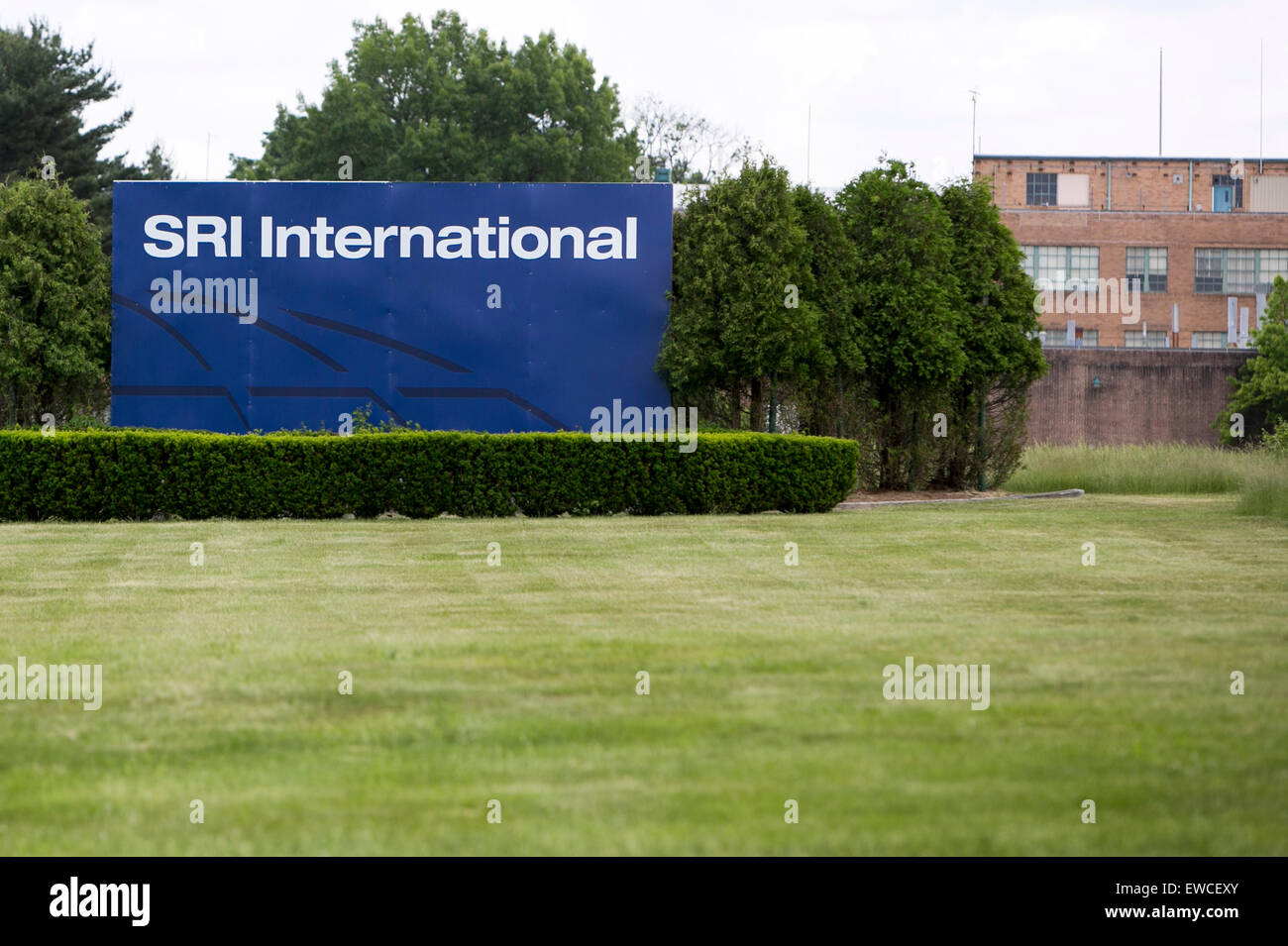A logo sign outside of a facility occupied by SRI International in ...