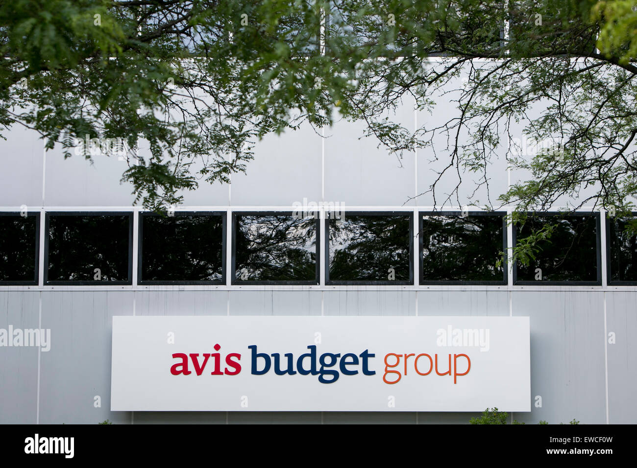 A logo sign outside of the headquarters of Avis Budget Group, Inc., in Parsippany, New Jersey. Stock Photo