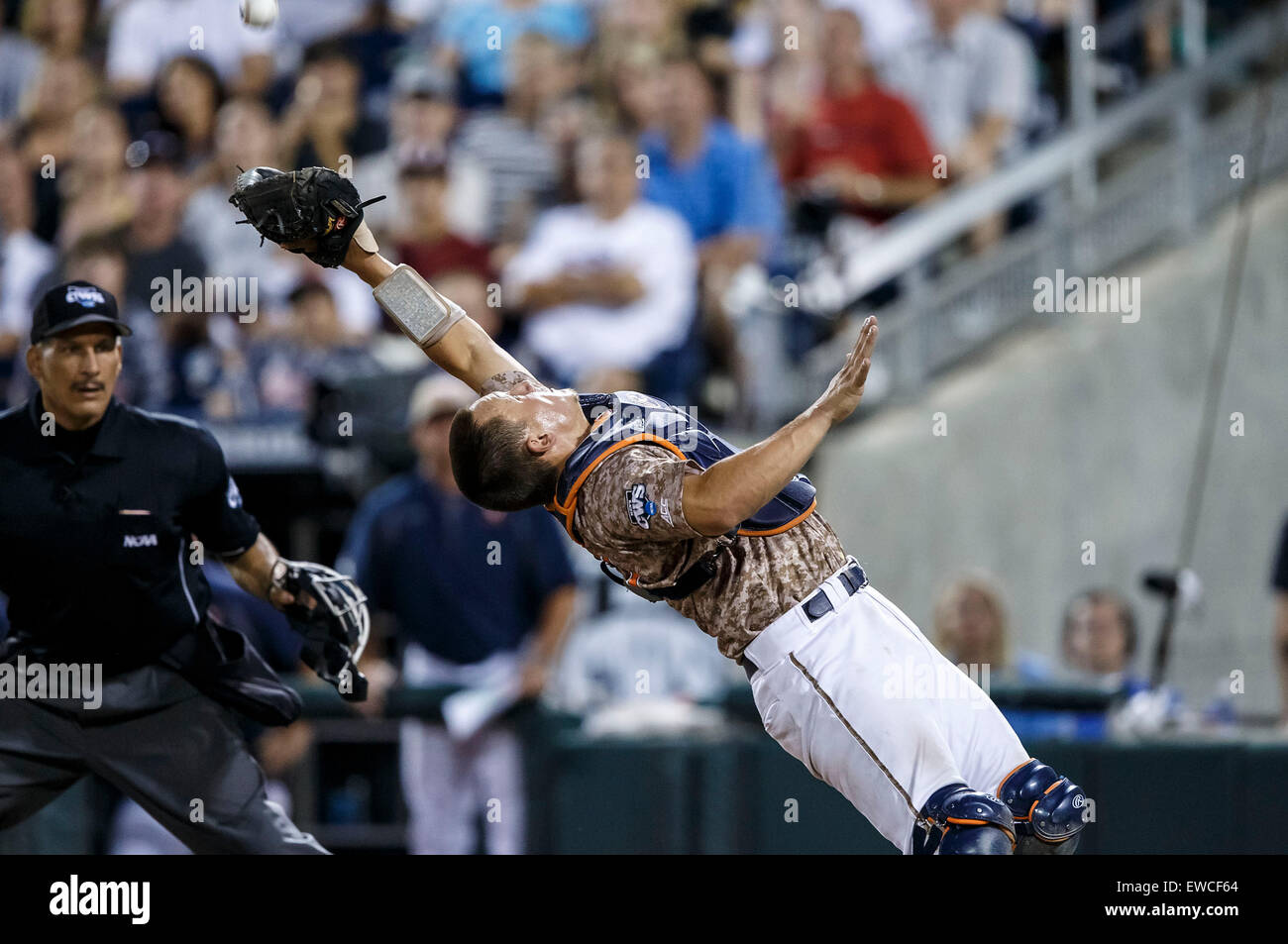 June 22, 2015: Home plate umpire Perry Costello watches as Virginia ...
