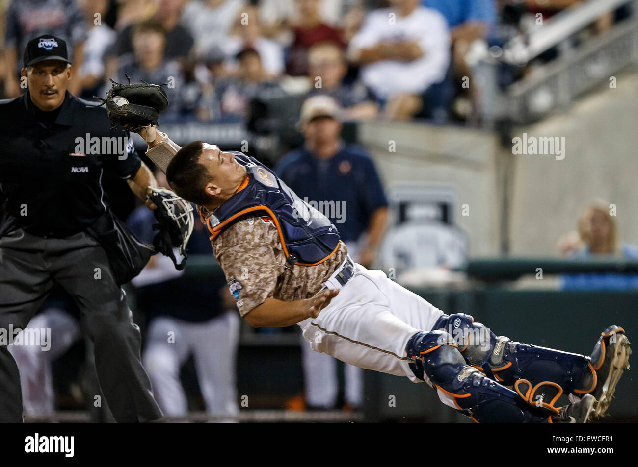 June 22, 2015: Home plate umpire Perry Costello watches as Virginia ...
