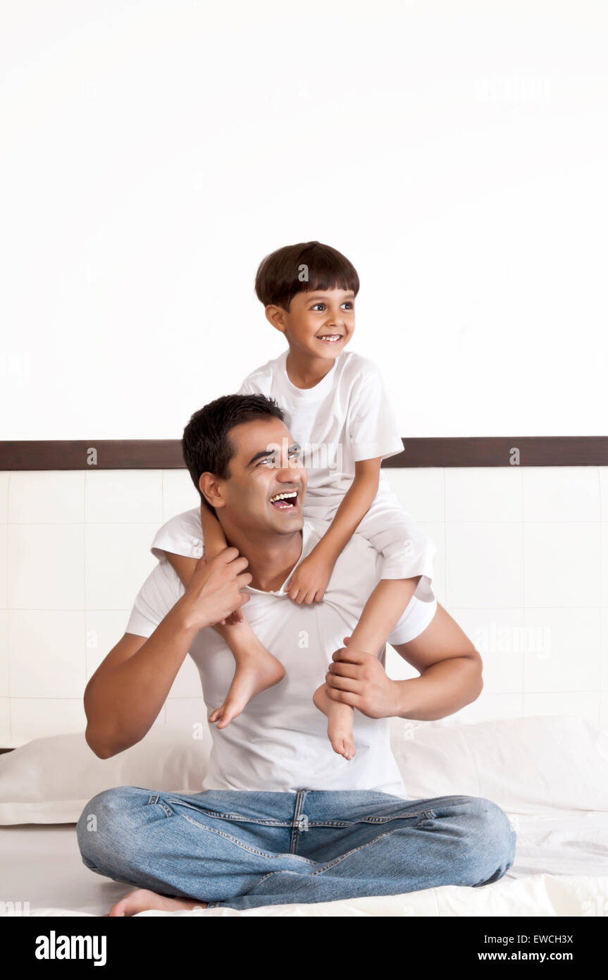 Son sitting father shoulder hi-res stock photography and images - Alamy