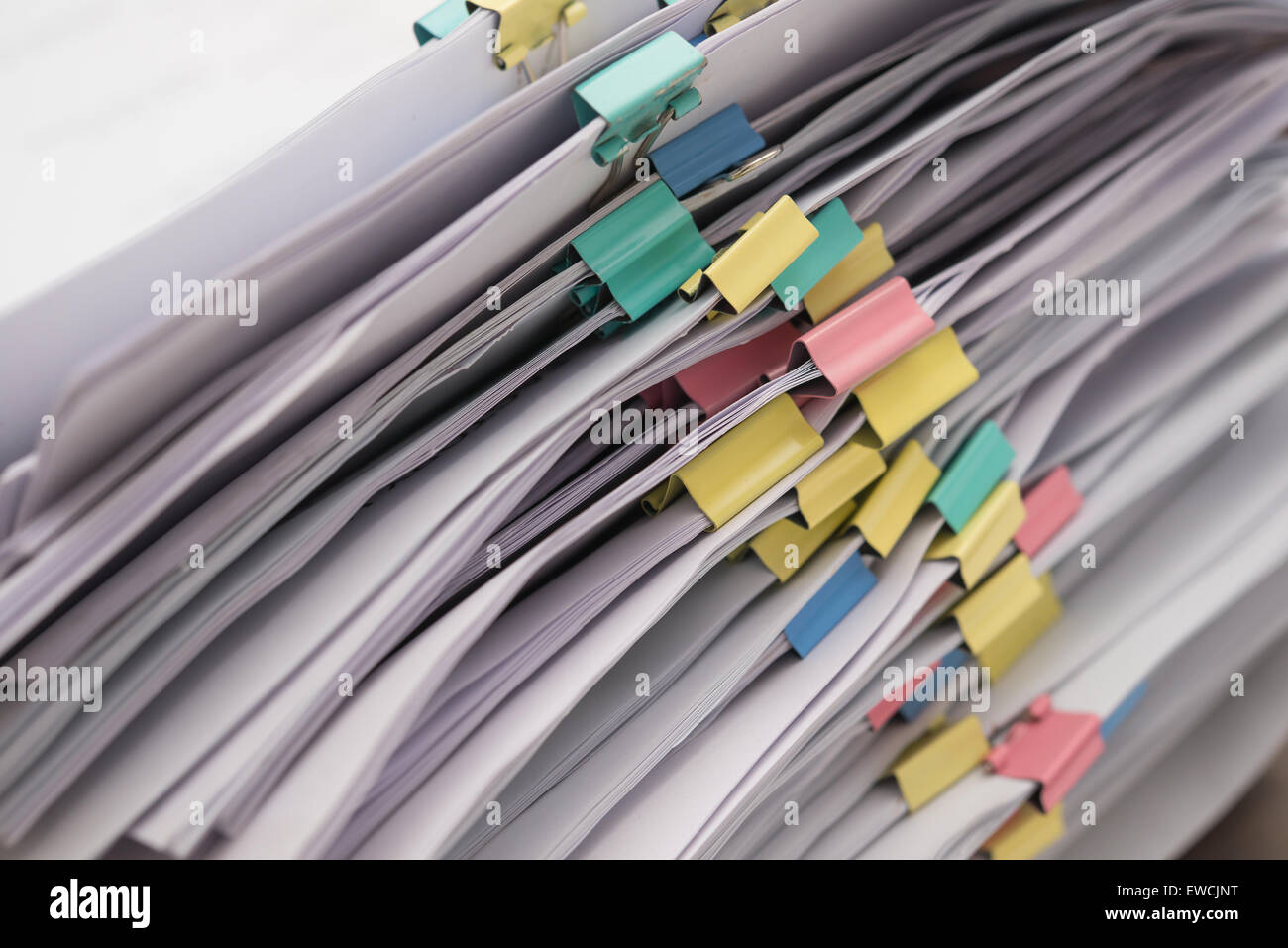 Pile of documents with colorful clips stack up Stock Photo