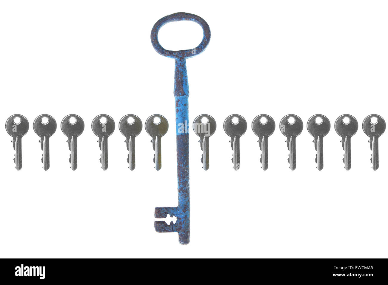 old big vintage forged key standing out from the crowd with small modern stock Stock Photo