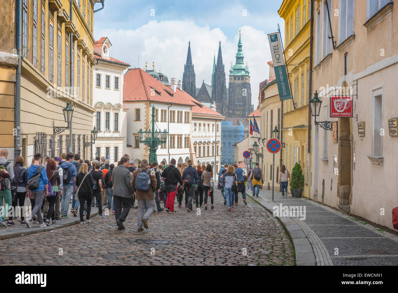 Prague Hradcany, view along Uvoz in the Hradcany district of Prague as a group of tourists head for the landmark St. Vitus Cathedral, Czech Republic. Stock Photo