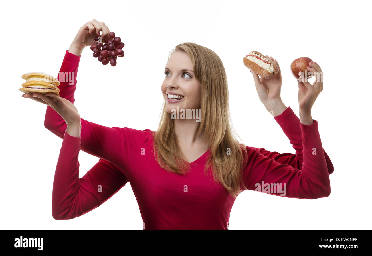 woman with four arms holding fruit and cakes in each hand Stock Photo