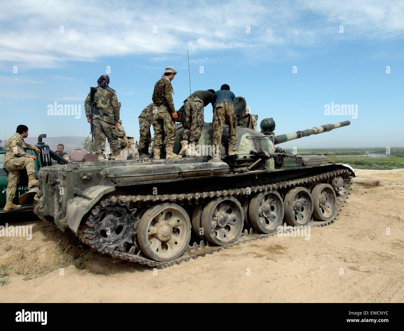(150623) -- KUNDUZ, June 23, 2015 (Xinhua) -- Afghan soldiers keep watch on a military tank during an operation against Taliban in Kunduz province, northern Afghanistan, June 23, 2015. Afghan National Security Forces (ANSF) on Tuesday recaptured a district in northern province of Kunduz seized by Taliban militants over the weekend, killing over 80 rebels, provincial government spokesman said. (Xinhua/Ajmal) (zjy) Stock Photo