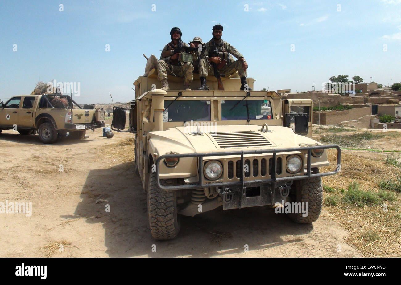(150623) -- KUNDUZ, June 23, 2015 (Xinhua) -- Afghan soldiers keep watch on a military vehicle during an operation against Taliban in Kunduz province, northern Afghanistan, June 23, 2015. Afghan National Security Forces (ANSF) on Tuesday recaptured a district in northern province of Kunduz seized by Taliban militants over the weekend, killing over 80 rebels, provincial government spokesman said. (Xinhua/Ajmal) (zjy) Stock Photo