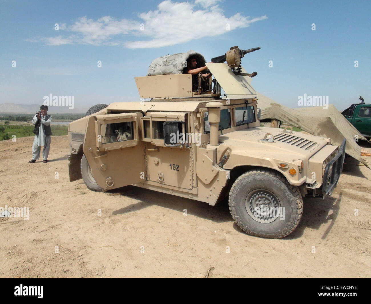 (150623) -- KUNDUZ, June 23, 2015 (Xinhua) -- An Afghan soldier keeps watch on a military vehicle during an operation against Taliban in Kunduz province, northern Afghanistan, June 23, 2015. Afghan National Security Forces (ANSF) on Tuesday recaptured a district in northern province of Kunduz seized by Taliban militants over the weekend, killing over 80 rebels, provincial government spokesman said. (Xinhua/Ajmal) (zjy) Stock Photo