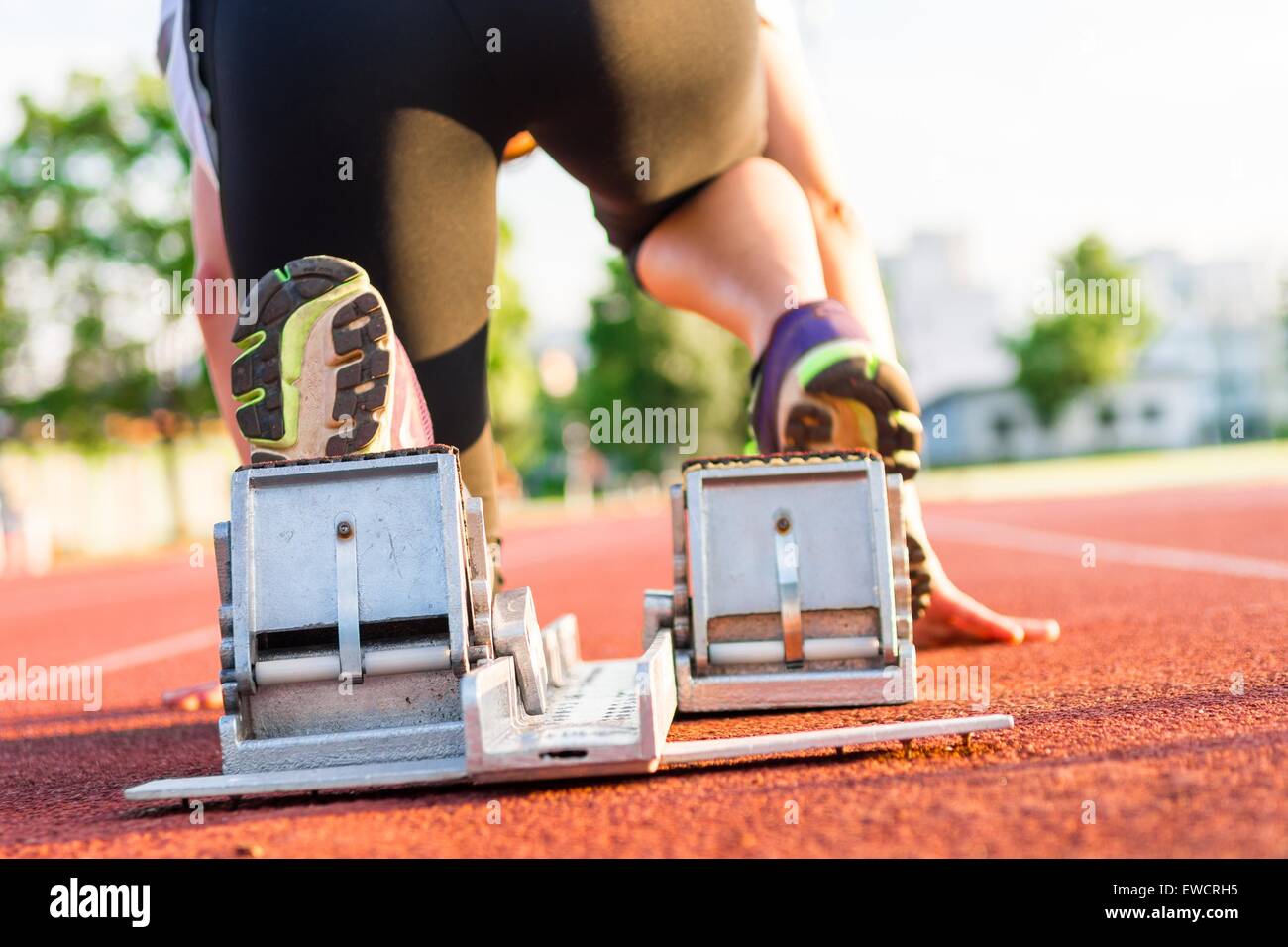 Sprinter getting ready to start Stock Photo - Alamy