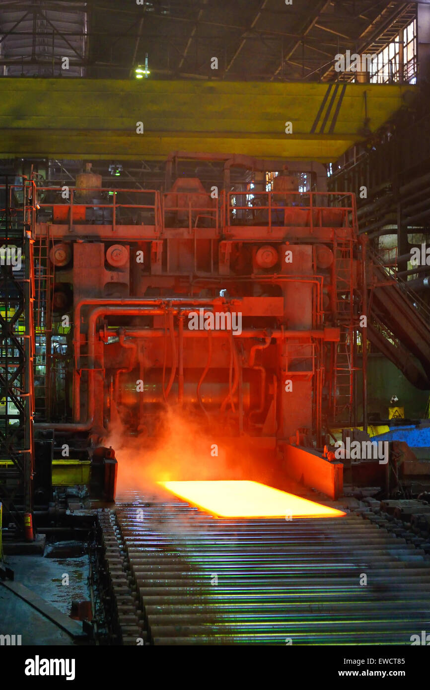 cooling hot steel on conveyor inside of steel plant Stock Photo