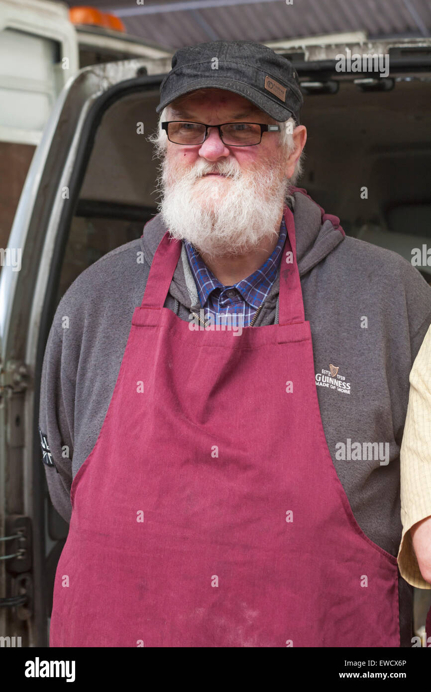 Portrait of market stall holder at market stall in Dorchester, Dorset