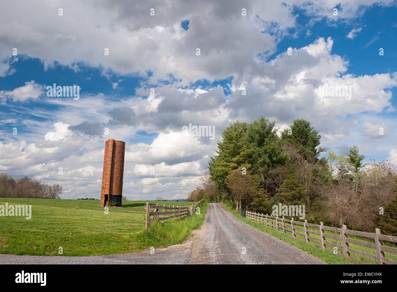 Unpaved country road and old unused tile silo in Shenandoah Valley, Virginia USA. Stock Photo