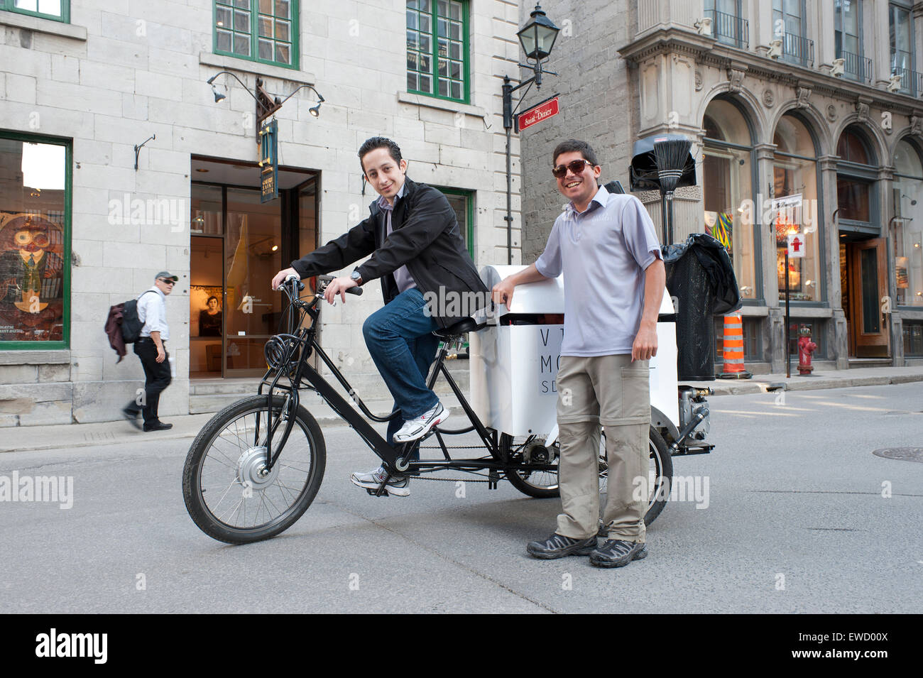 Young street cleaners, Old Montreal, province of Quebec, Canada. Stock Photo