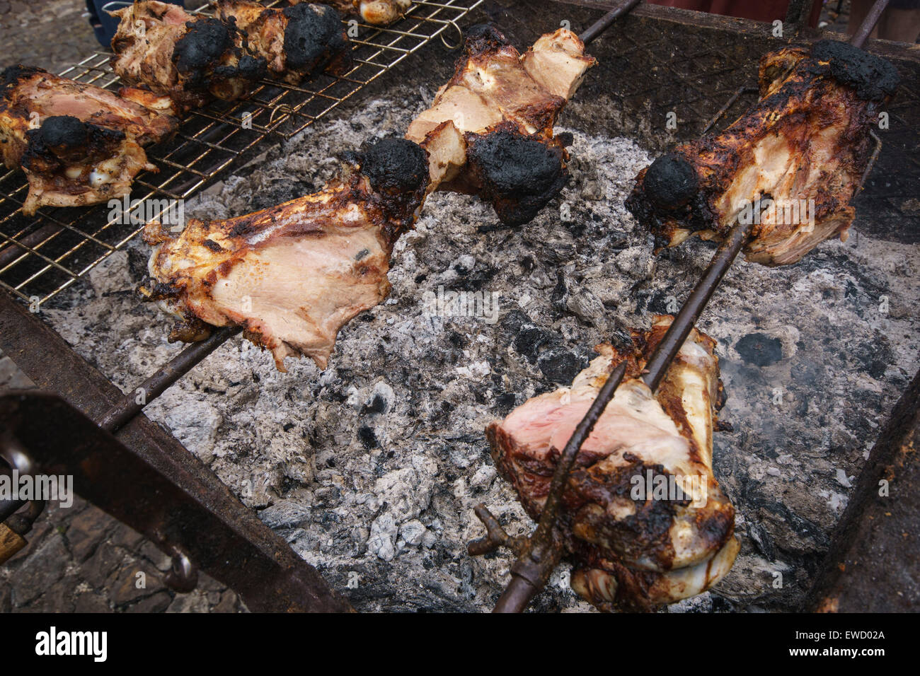 Pieces of meat roasting over charcoal Stock Photo