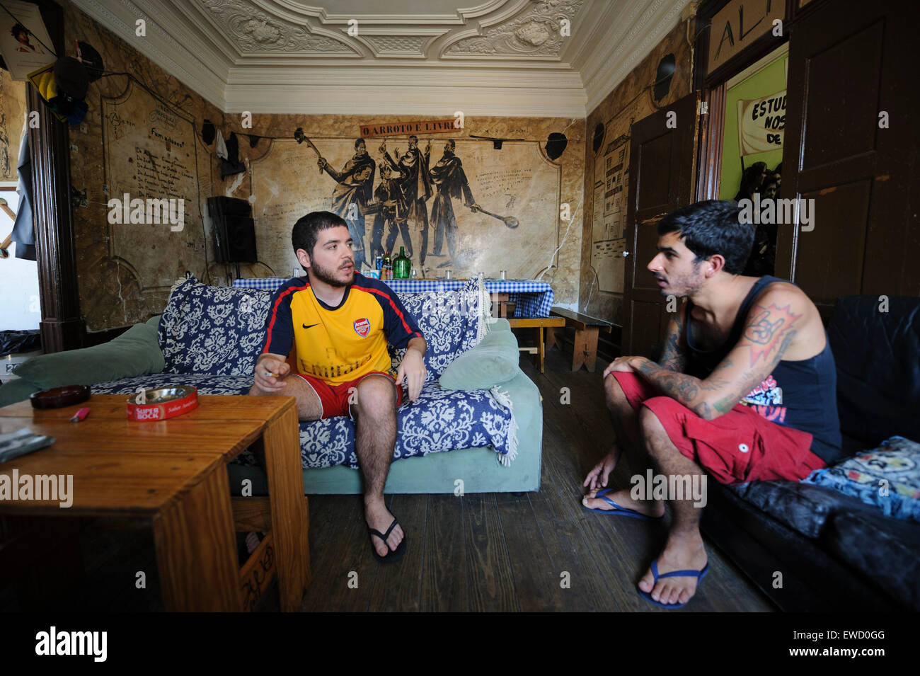 Two young men talking at the Real Republica do Rás Teparta - typical student housing in Coimbra, Portugal Stock Photo