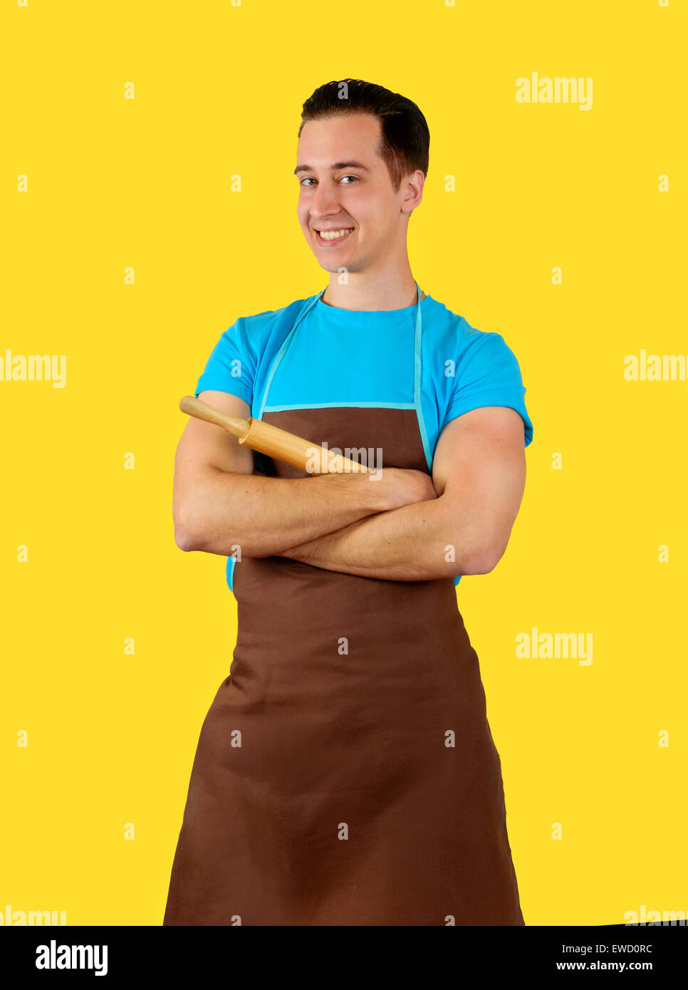 https://c8.alamy.com/comp/EWD0RC/the-man-in-the-kitchen-wearing-an-apron-holding-a-rolling-pin-isolated-EWD0RC.jpg