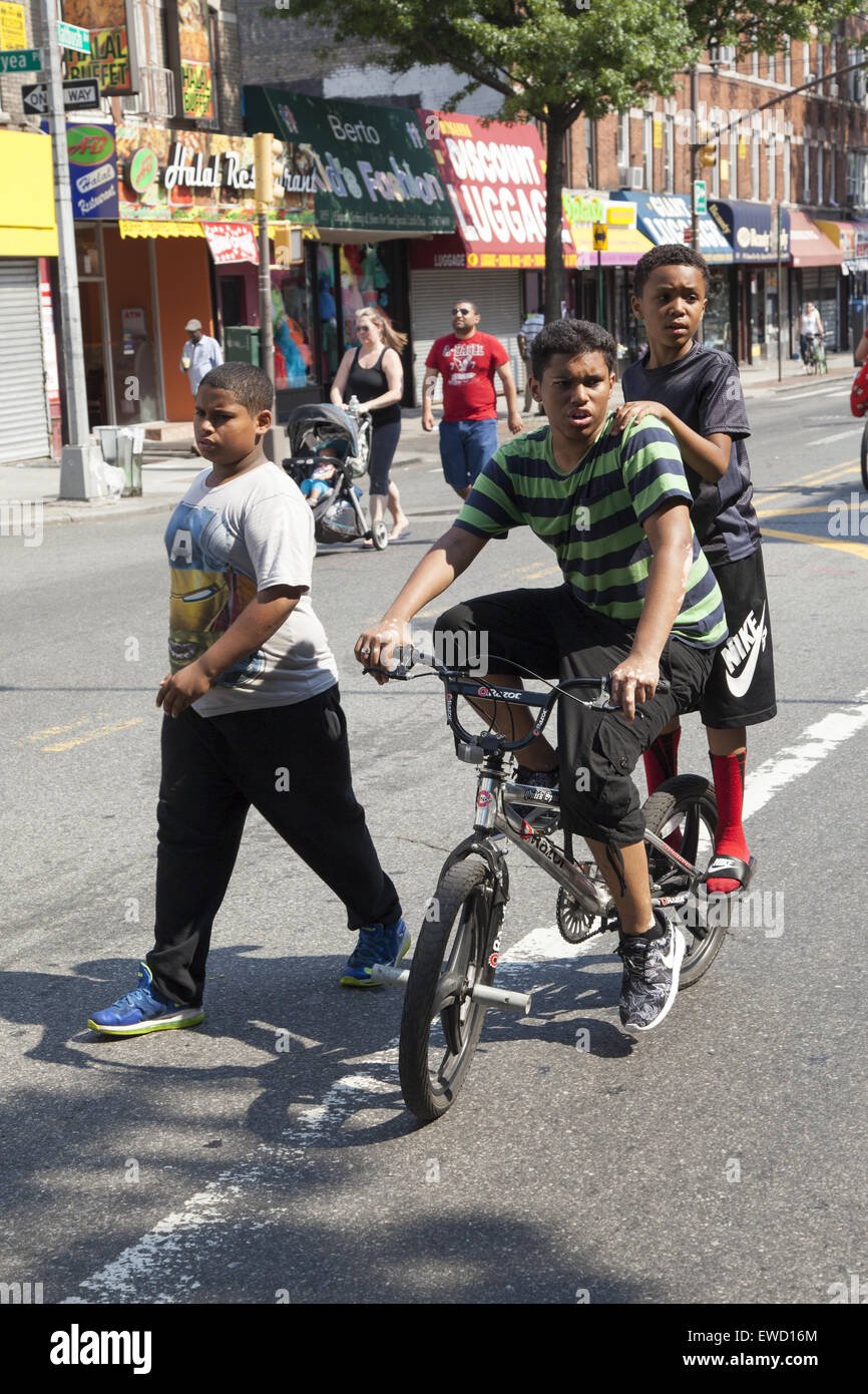 Young boys on Flatbush Ave. during a street festival in Brooklyn, NY. Stock Photo