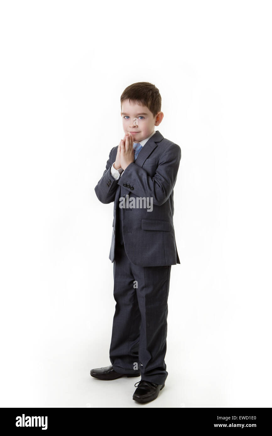 young boy dressed up in a office suit standing praying Stock Photo - Alamy