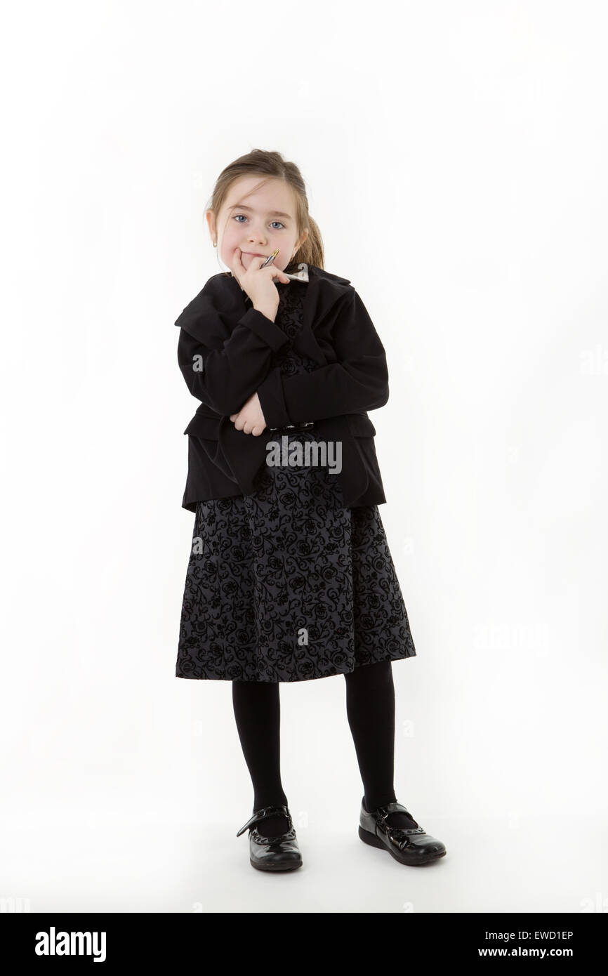standing young girl dressed up as a business person thinking Stock Photo Alamy