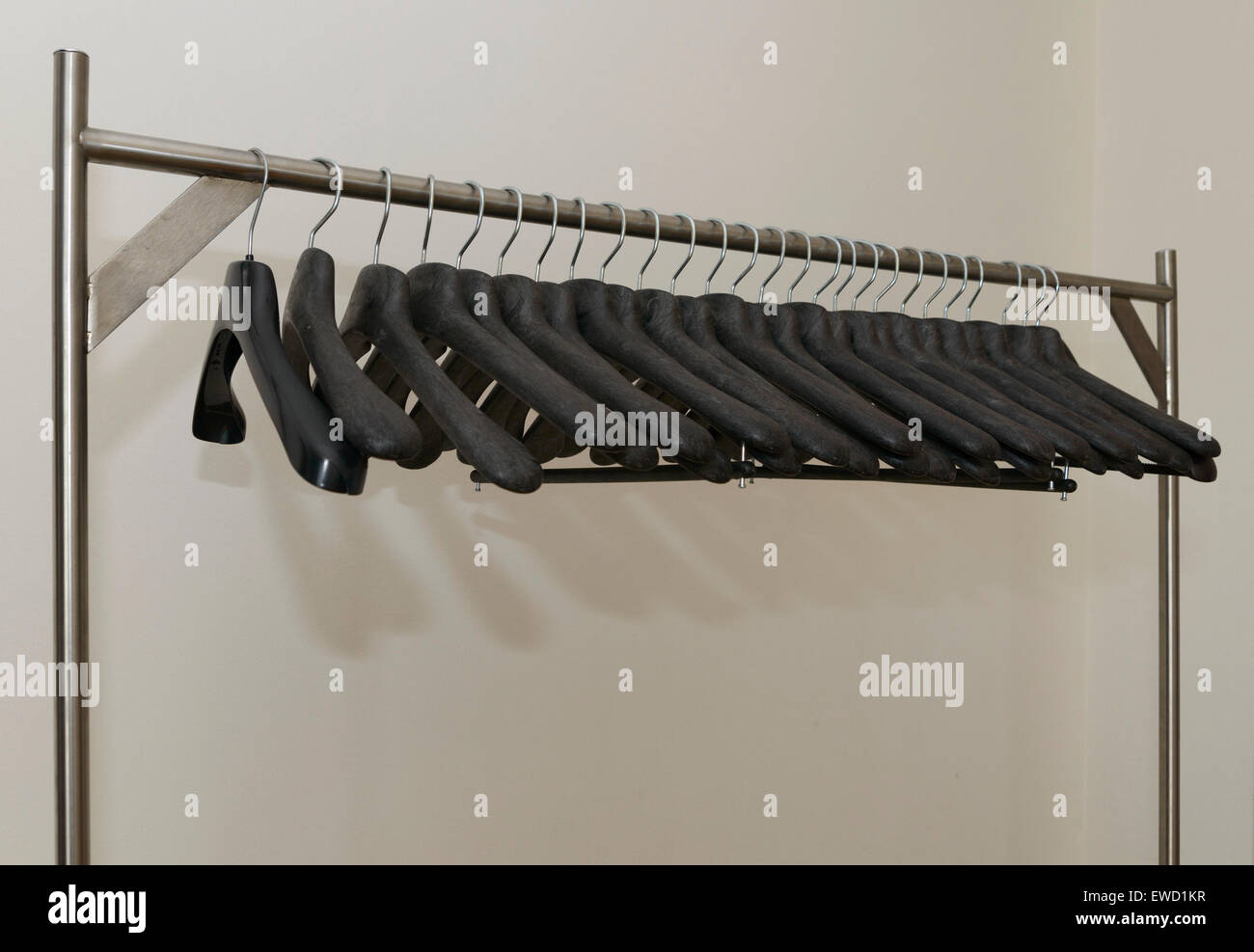 Row of black plastic coat hangers Stock Photo Alamy