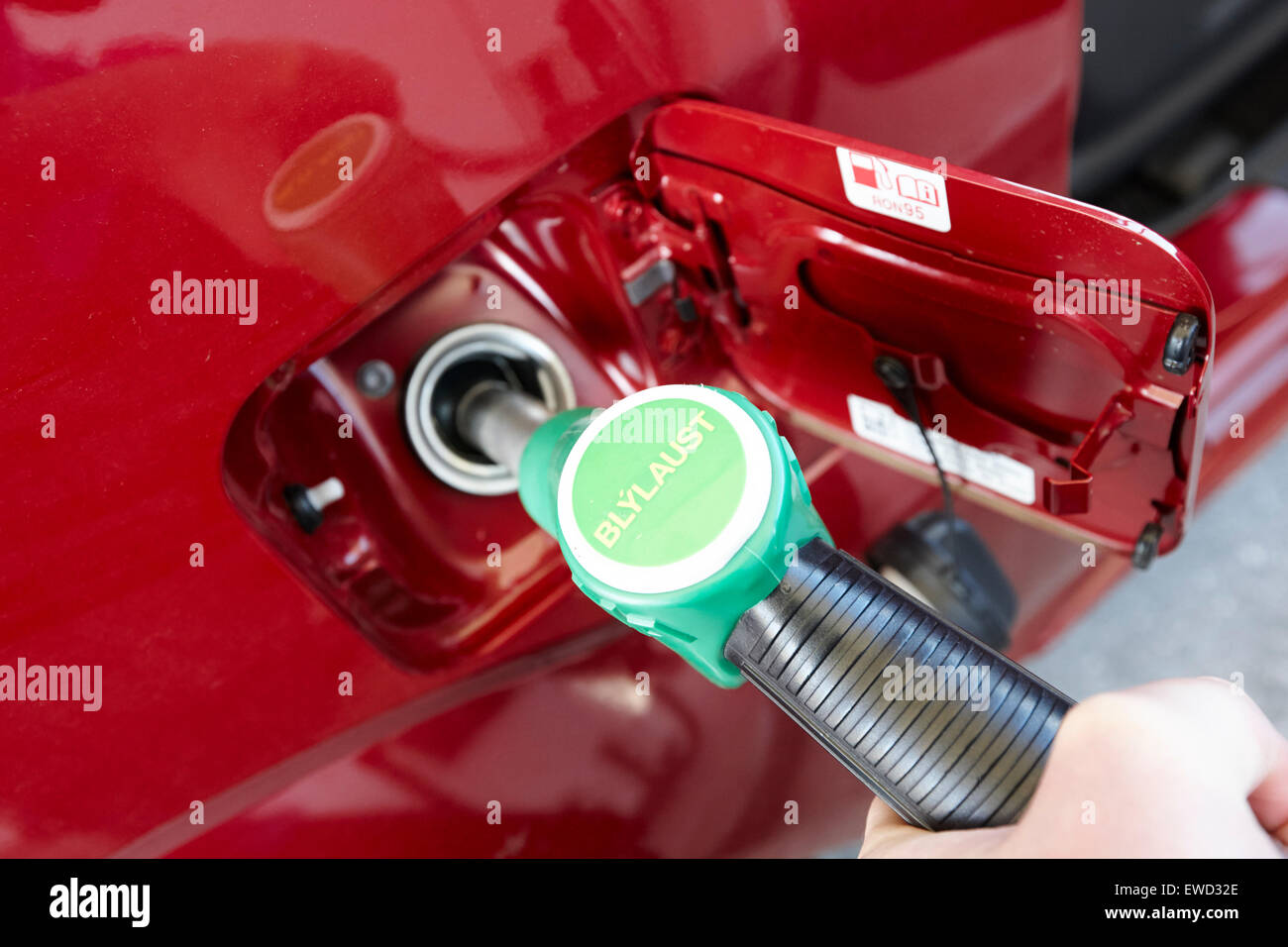 filling vehicle with unleaded petrol in iceland Stock Photo