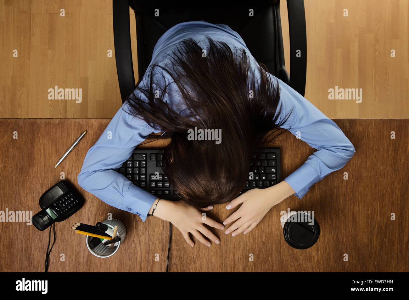 woman asleep at her desk taken from a birds eye view Stock Photo - Alamy
