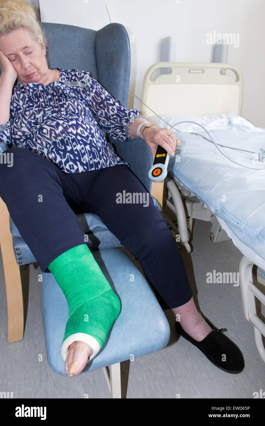 Eighty two year old woman in hospital with broken ankle set in plaster. Stock Photo