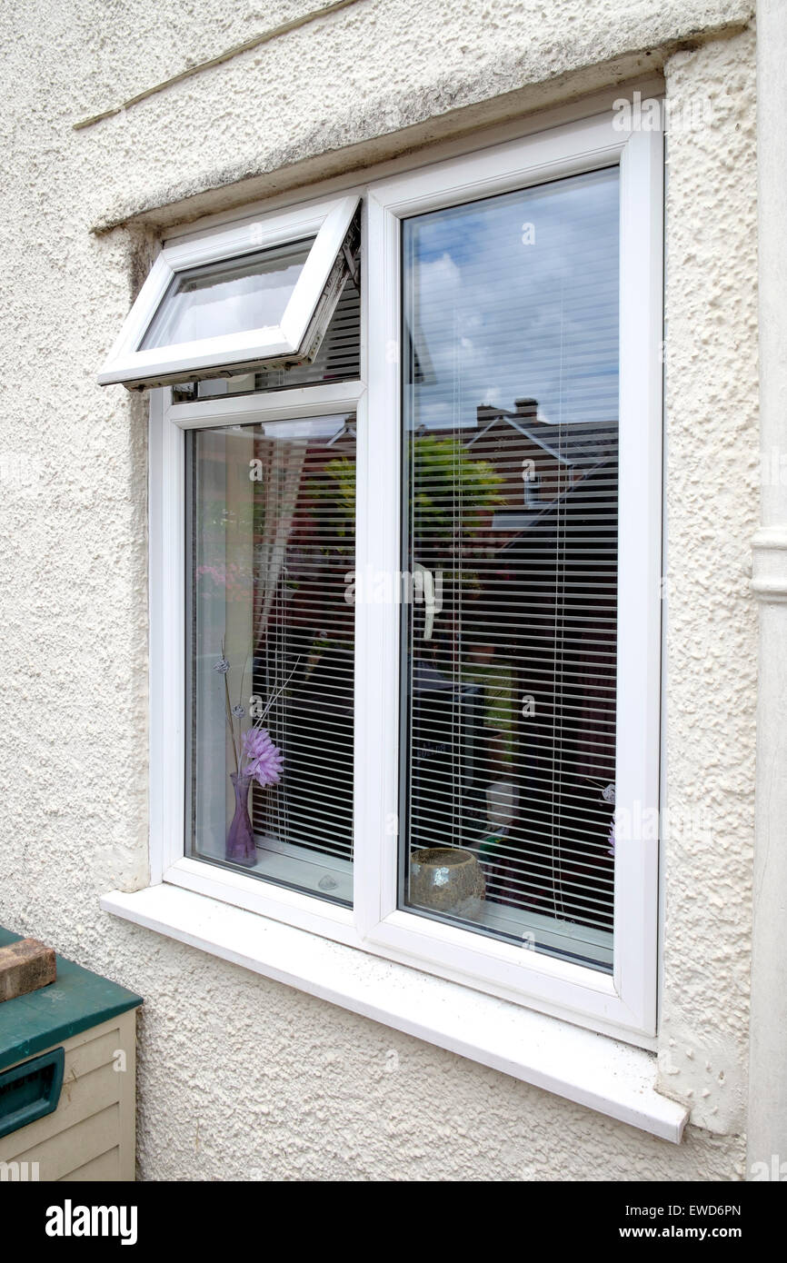 House double glazed window with open quarter light posing security risk of burglary Stock Photo