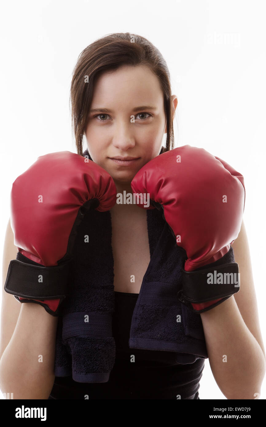 young woman wearing boxing gloves working out and keeping fit Stock
