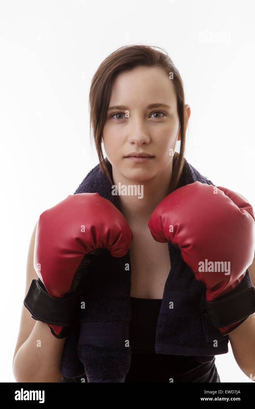 young woman wearing boxing gloves working out and keeping fit Stock