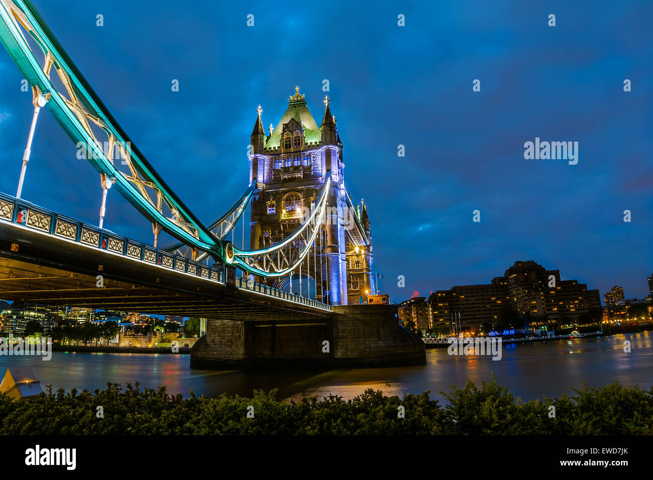 Bridge Tower night view from the bridge, London United Kingdom. A combined bascule and suspension bridge which crosses the River Stock Photo