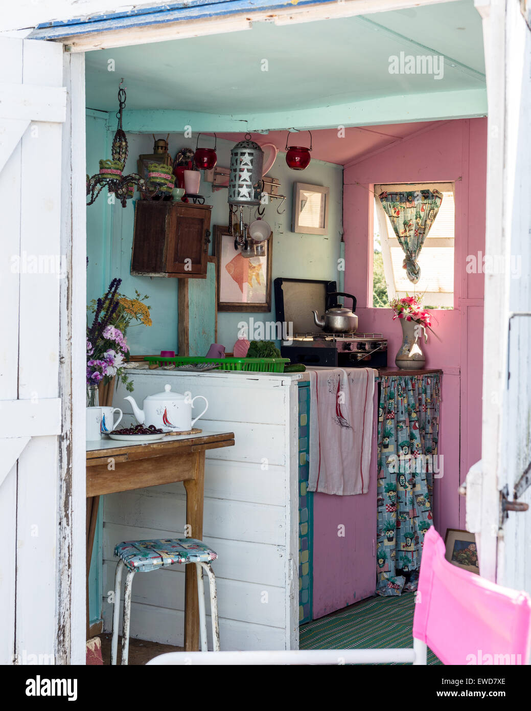 Portable stove and selection of lanterns in beach hut with vintage feel Stock Photo