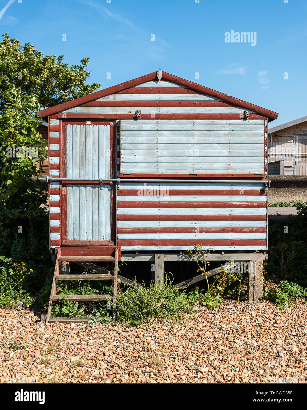 Rustic looking striped beach hut Stock Photo