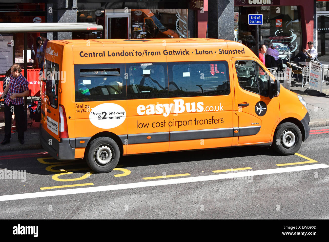 Easy Bus British express coach operator originally founded by Stelios Haji-Ioannou parked whilst picking up passengers at bus stop London England UK Stock Photo